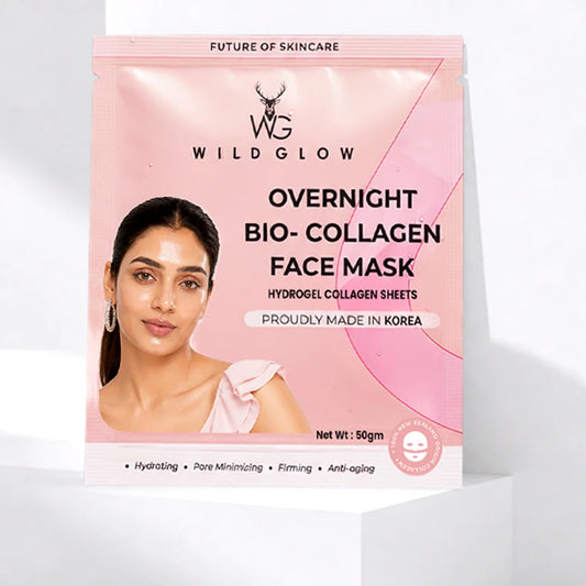 Wildglow Overnight Bio-Collagen Face Mask in a pink stand-up pouch, displayed on a white geometric pedestal against a light gray background.