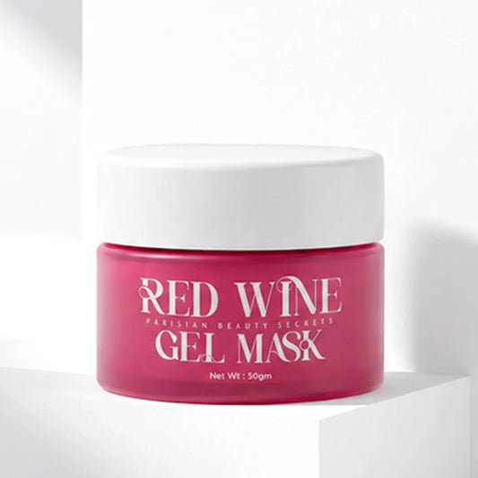 A jar of Red Wine Gel Mask by Eurasian Beauty Secrets, featuring a vibrant pink jar and a white lid, displayed on a minimalist white geometric pedestal.