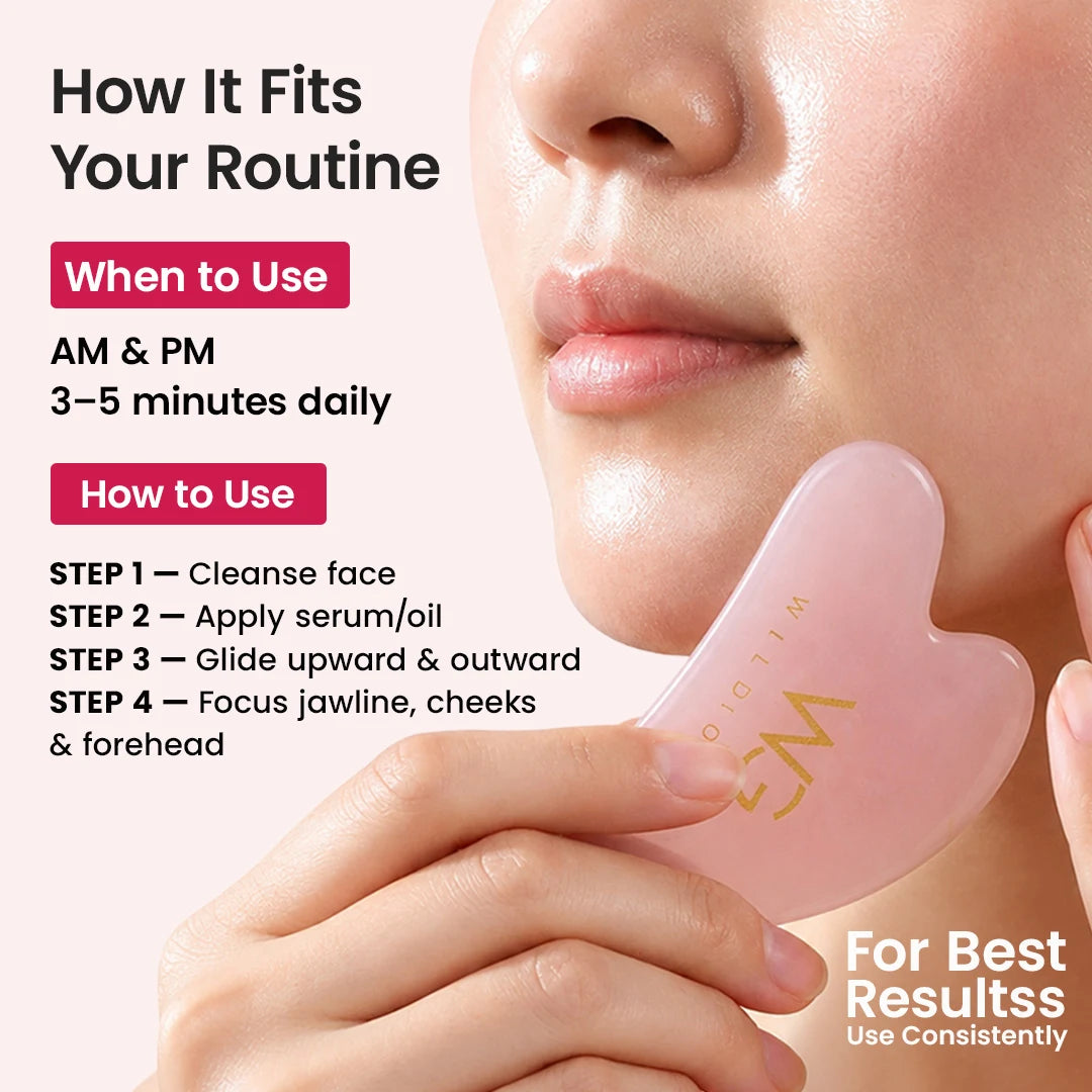 A close-up of a person holding a translucent pink heart-shaped facial massage tool against their cheek, with text explaining how to use it in AM and PM and step-by-step instructions on a pale pink background.