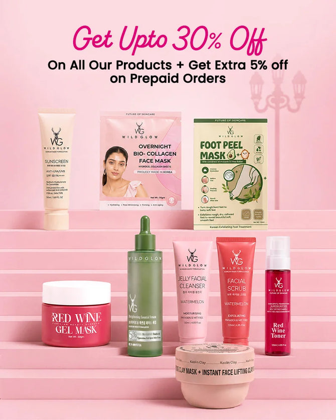 A promotional display of multiple VGD Beauty skincare products arranged on pink steps, with large text at the top reading 'Get Upto 30% Off'. Visible products include sunscreen, a bio-collagen face mask, a foot peel mask, a red wine gel mask, a facial cleanser, a facial scrub, a red wine toner, and an instant face lifting mask.